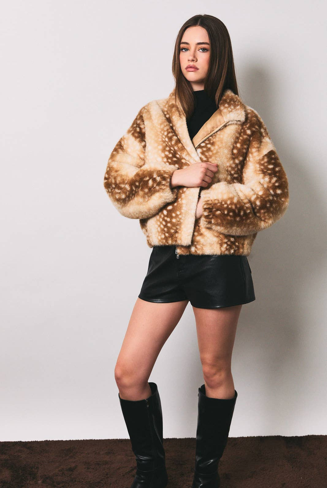 LE LIS faux deer print high neck zip jacket, featuring a stylish high collar and zip closure with a distinctive faux deer pattern.