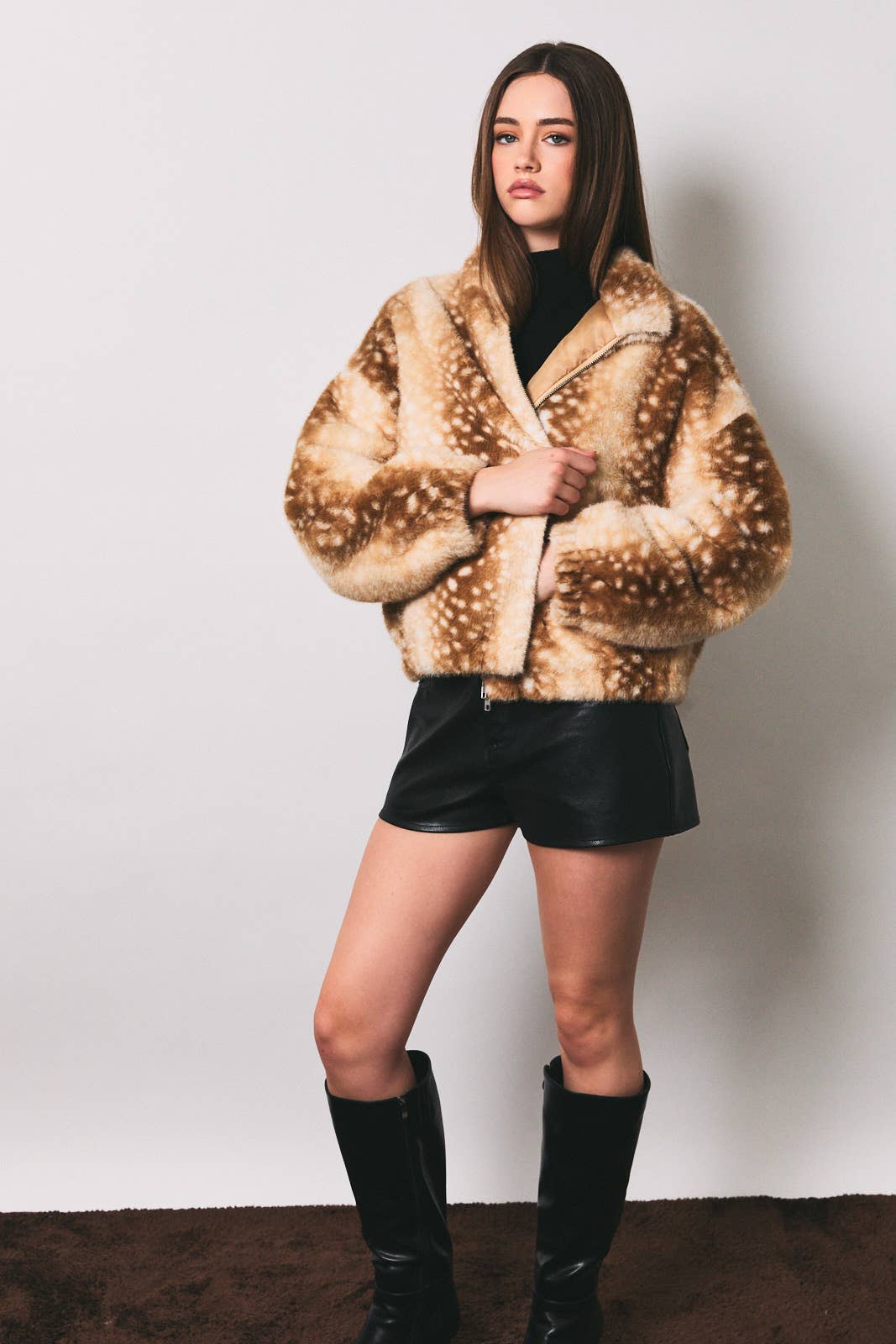 LE LIS faux deer print high neck zip jacket, featuring a stylish high collar and zip closure with a distinctive faux deer pattern.