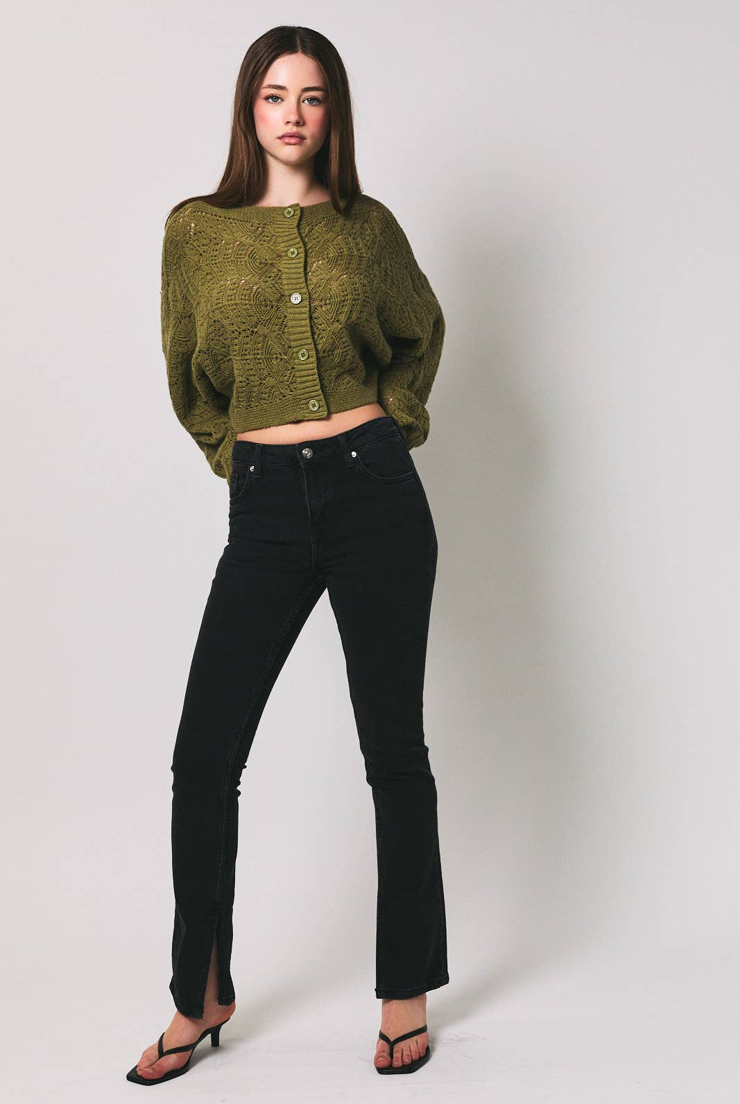 Light beige long sleeve crochet cardigan by LE LIS with intricate open-knit pattern and soft, comfortable fit.
