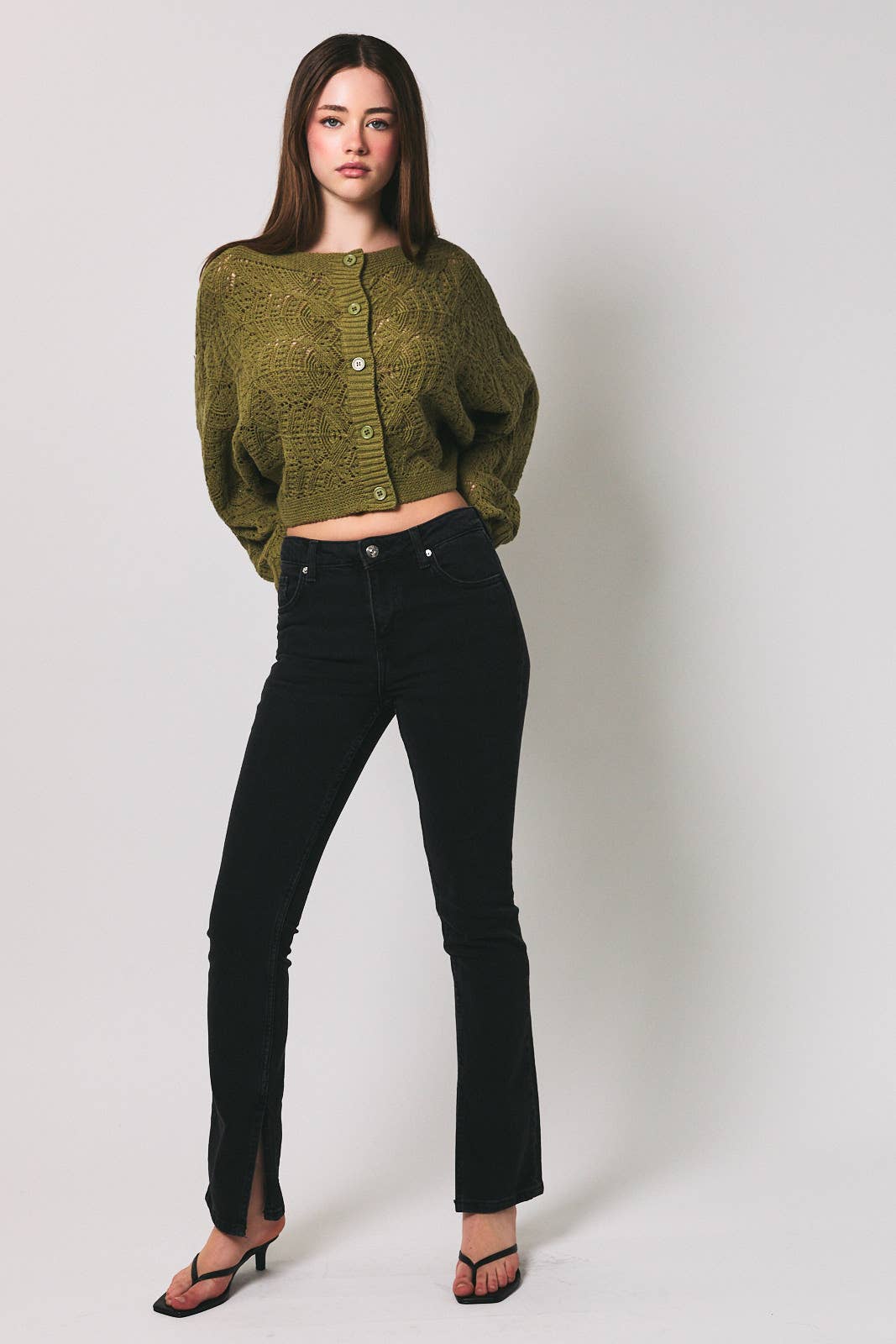 Light beige long sleeve crochet cardigan by LE LIS with intricate open-knit pattern and soft, comfortable fit.