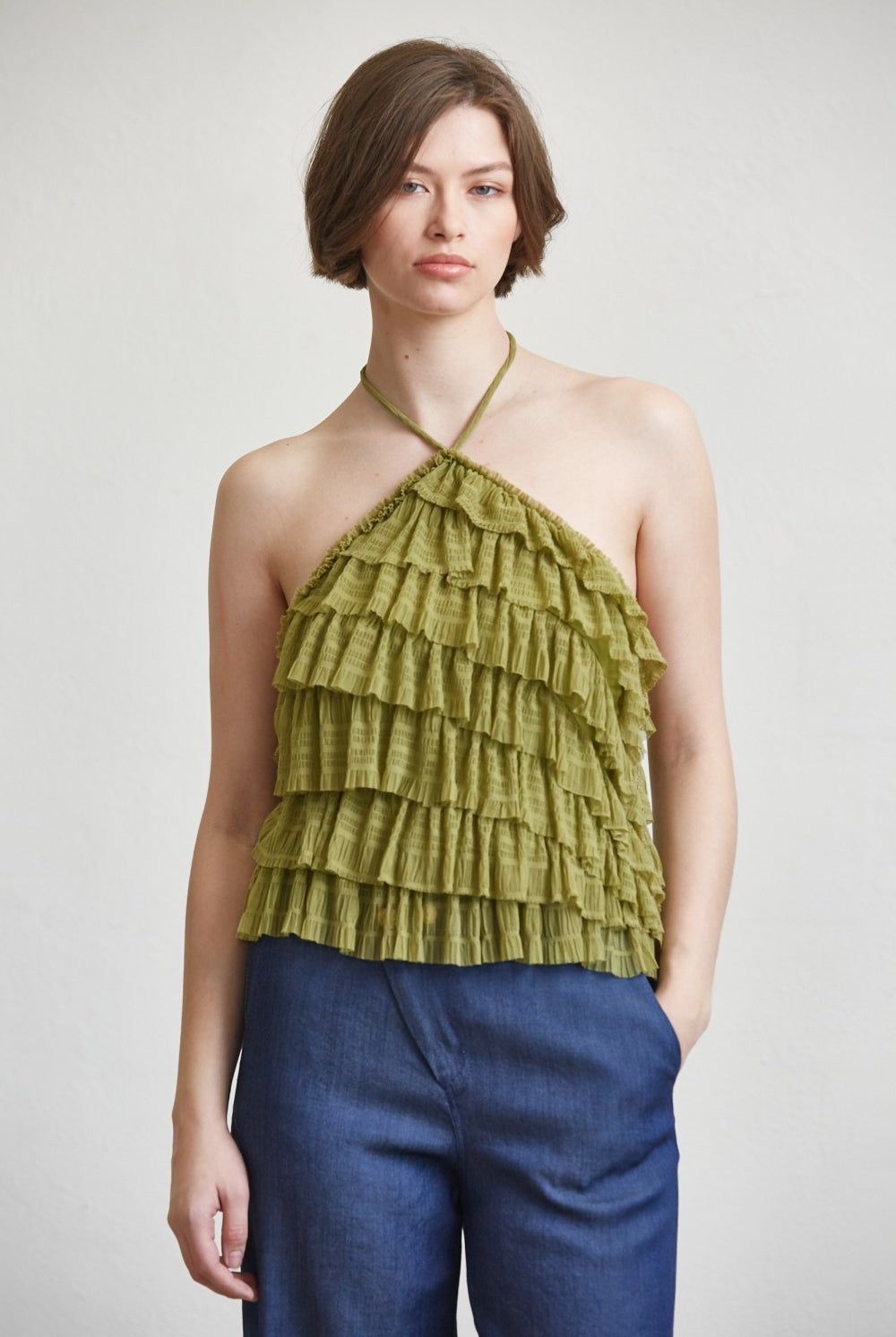 RARA Boutique tiered ruffle halter neck tank top with layered fabric and feminine design, shown on a model.