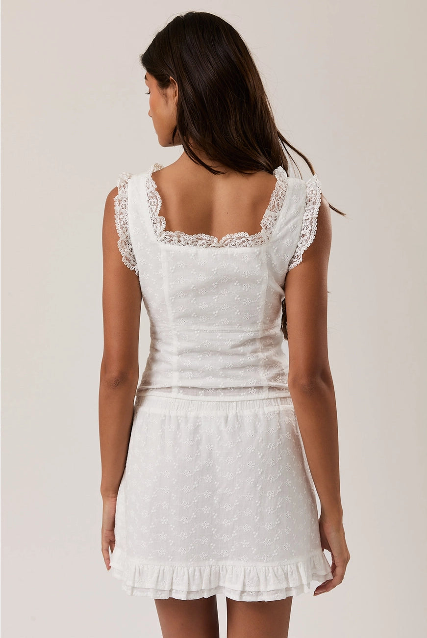 RARA Boutique sleeveless square neck blouse with eyelet lace trim, stylish top featuring a lightweight fabric and feminine design.