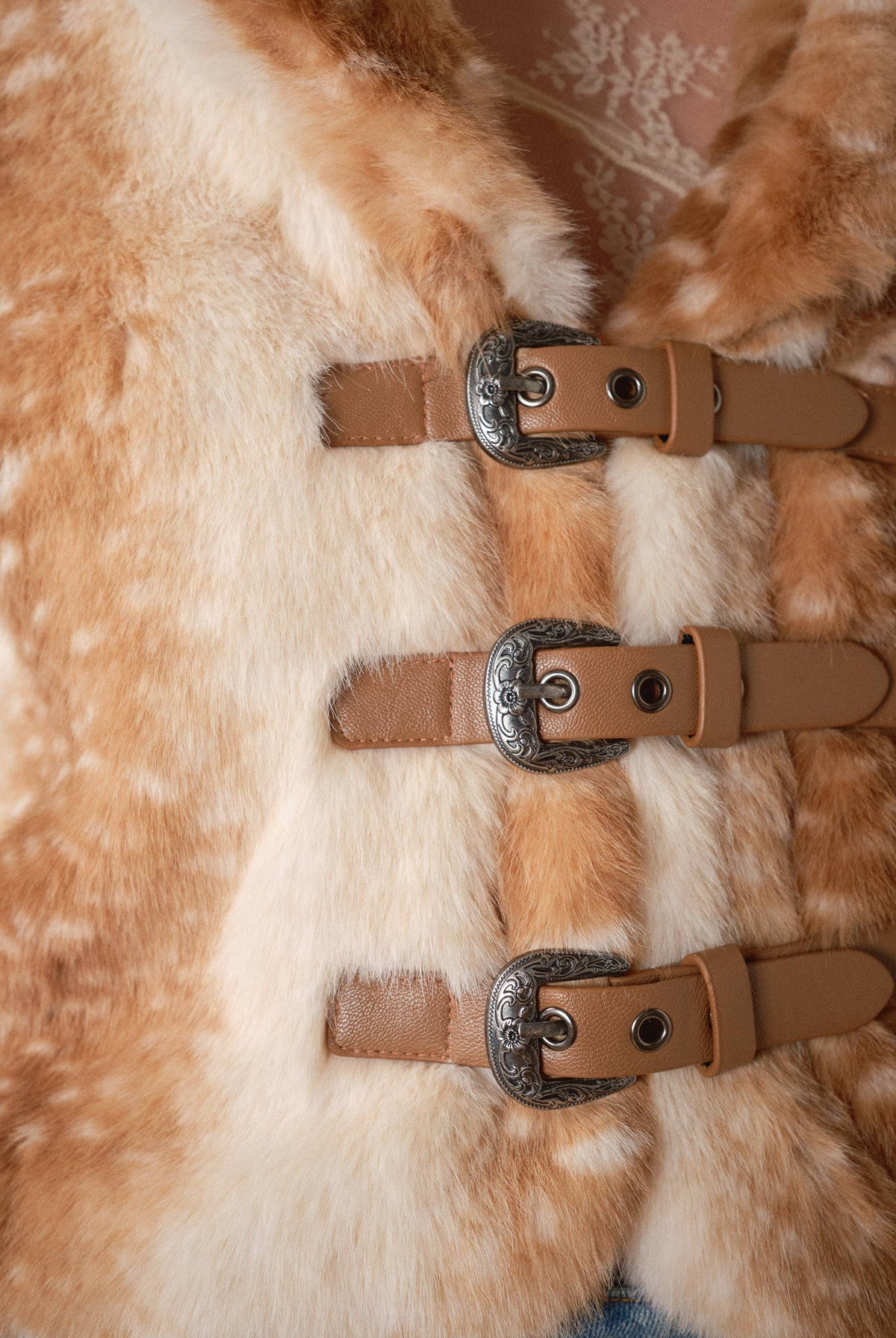 Blue B 25004J Buckled Deer Print Faux Fur Jacket featuring a buckled design and deer print pattern on soft, cozy faux fur.