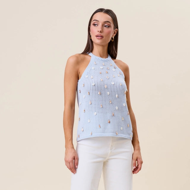Seashell embellished open knit halter tank top in beige from RARA Boutique, featuring a stylish open-knit design and seashell accents.