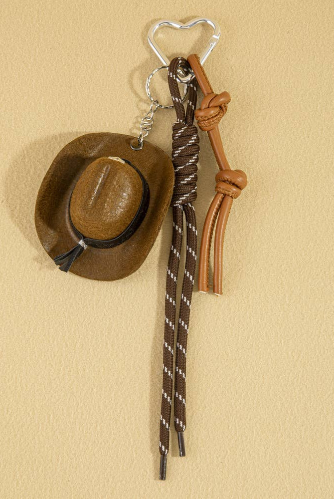 Mini cowboy hat western rope bag charm with gold accents, featuring a rustic cowboy style accessory for bags and keychains.