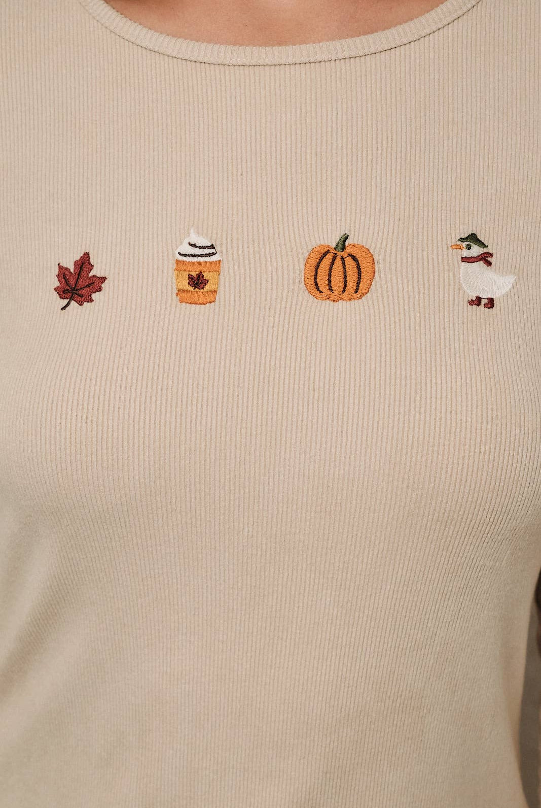 Round neck long sleeve ribbed top with fall-themed embroidery by Sunday Edition, featuring autumn-inspired designs.