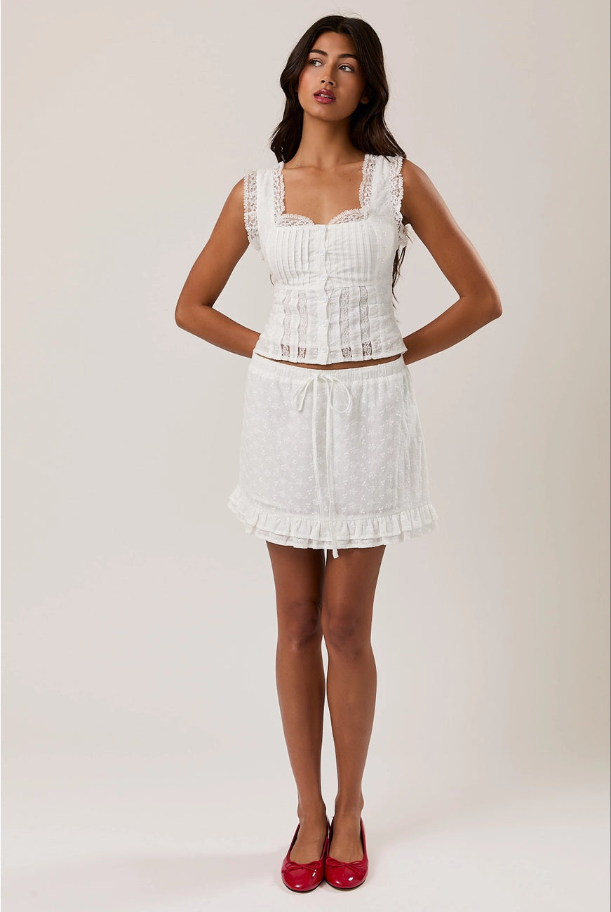 RARA Boutique sleeveless square neck blouse with eyelet lace trim, featuring a stylish and feminine design.