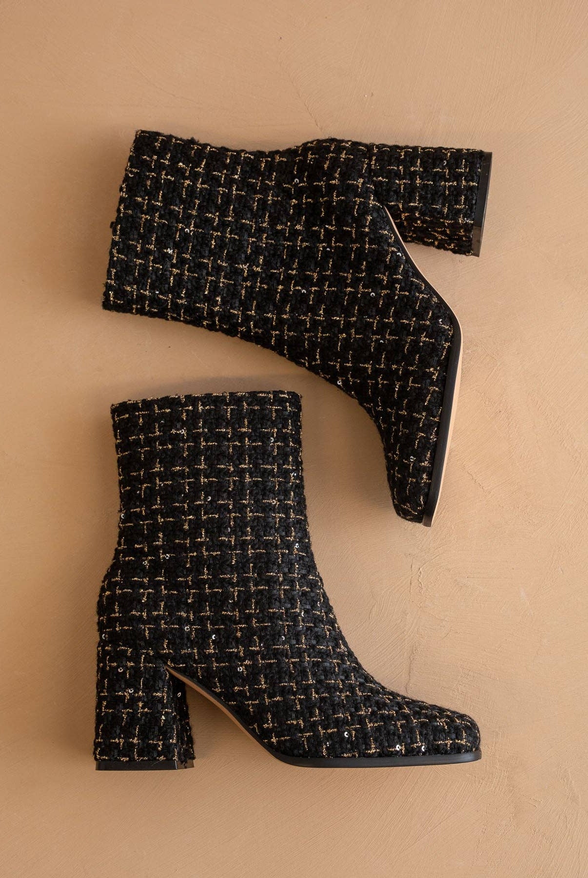 Black tweed woven block heel ankle boot from Oasis Society with a stylish fall design and sturdy heel.
