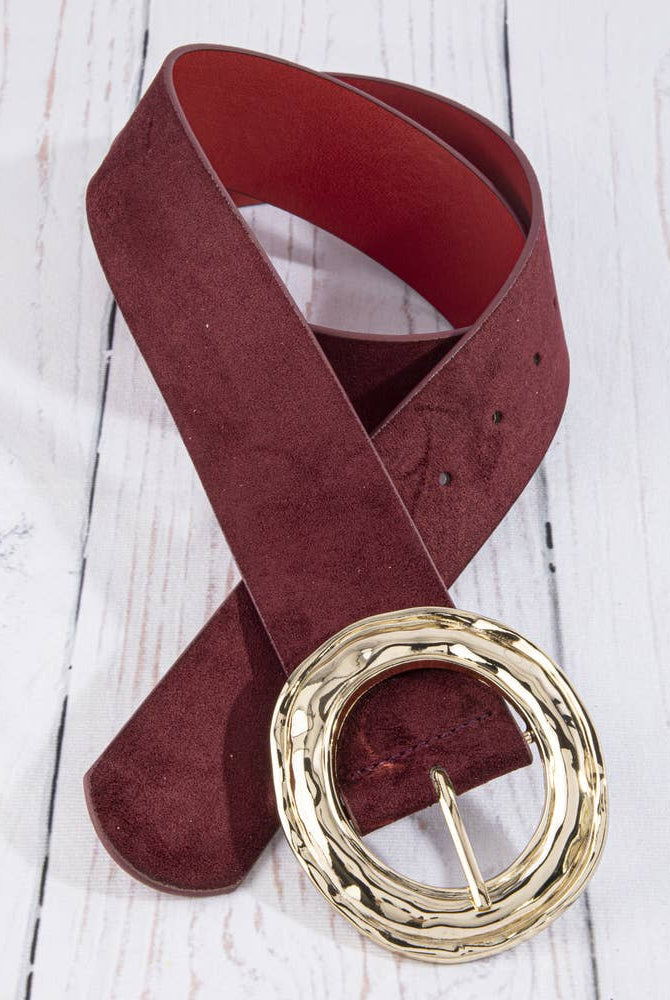 Suede hammered round buckle belt by Collections by Fame Accessories, featuring a textured leather strap with a round metal buckle.