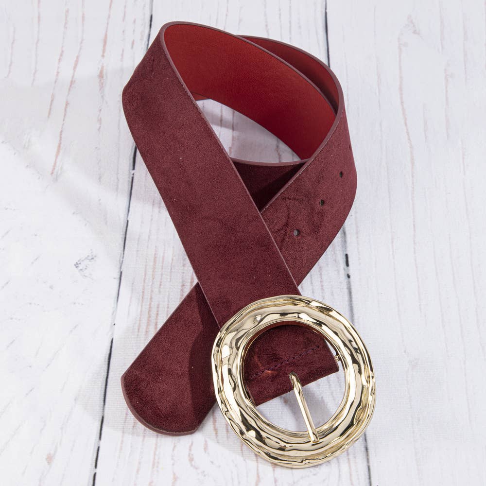 Suede hammered round buckle belt by Collections by Fame Accessories, featuring a textured leather strap with a round metal buckle.