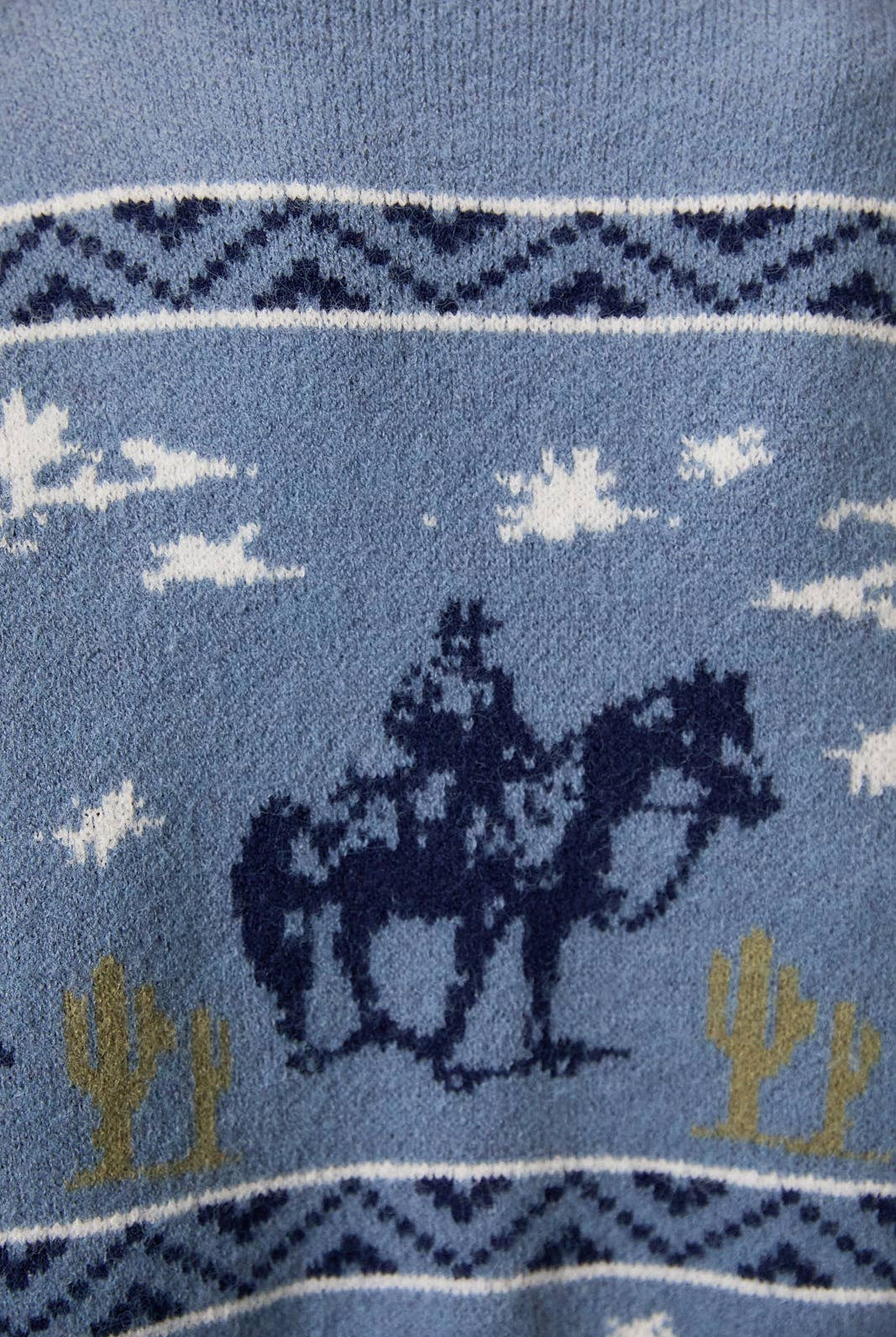 LE LIS long sleeve crew neck cowboy graphic sweater featuring a detailed Western-inspired design on soft knit fabric.
