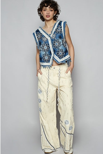 RARA Boutique crochet floral V-neck denim vest with intricate floral crochet details and classic sleeveless design.