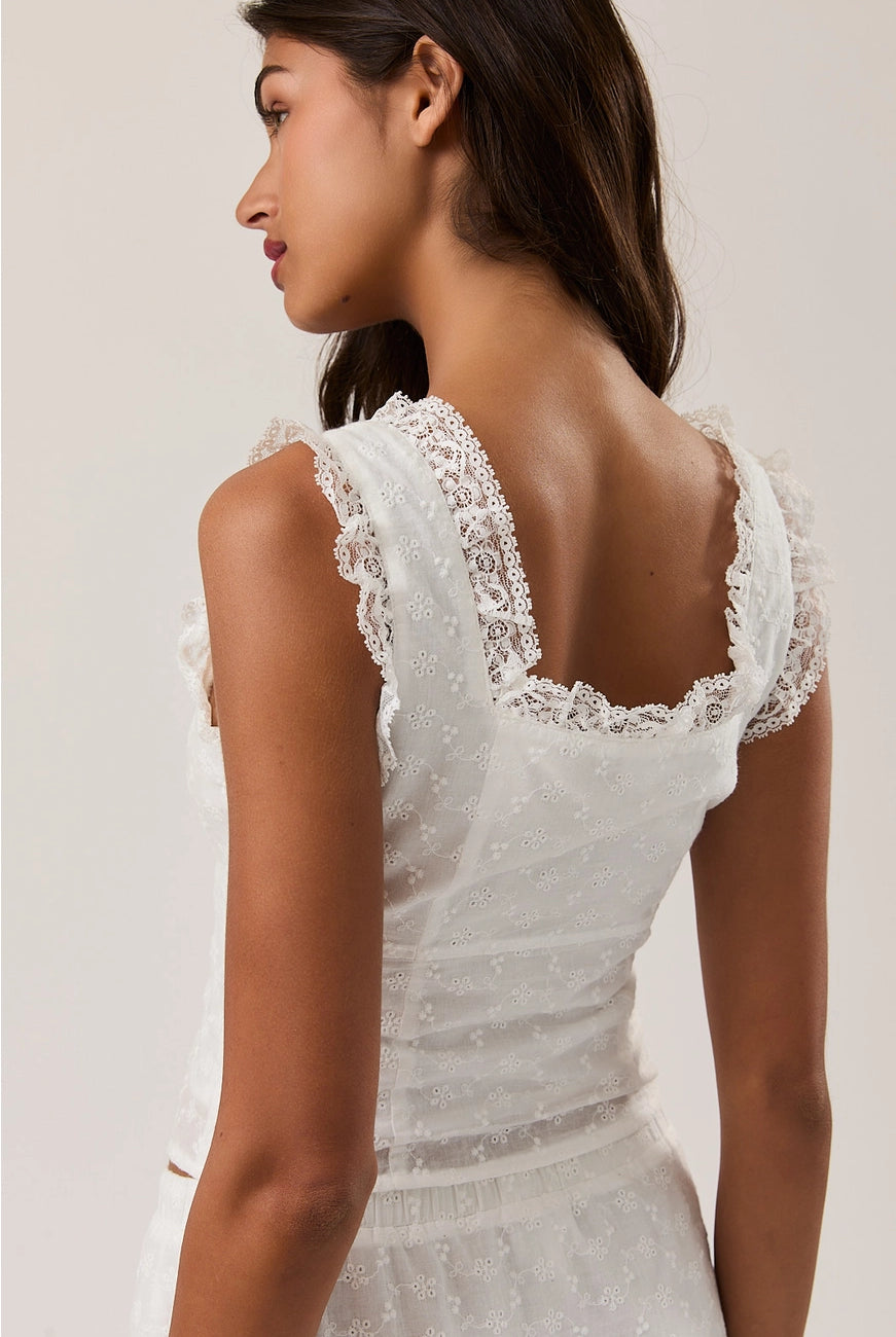 RARA Boutique eyelet lace trim sleeveless square neck blouse with delicate lace details and a feminine fit.