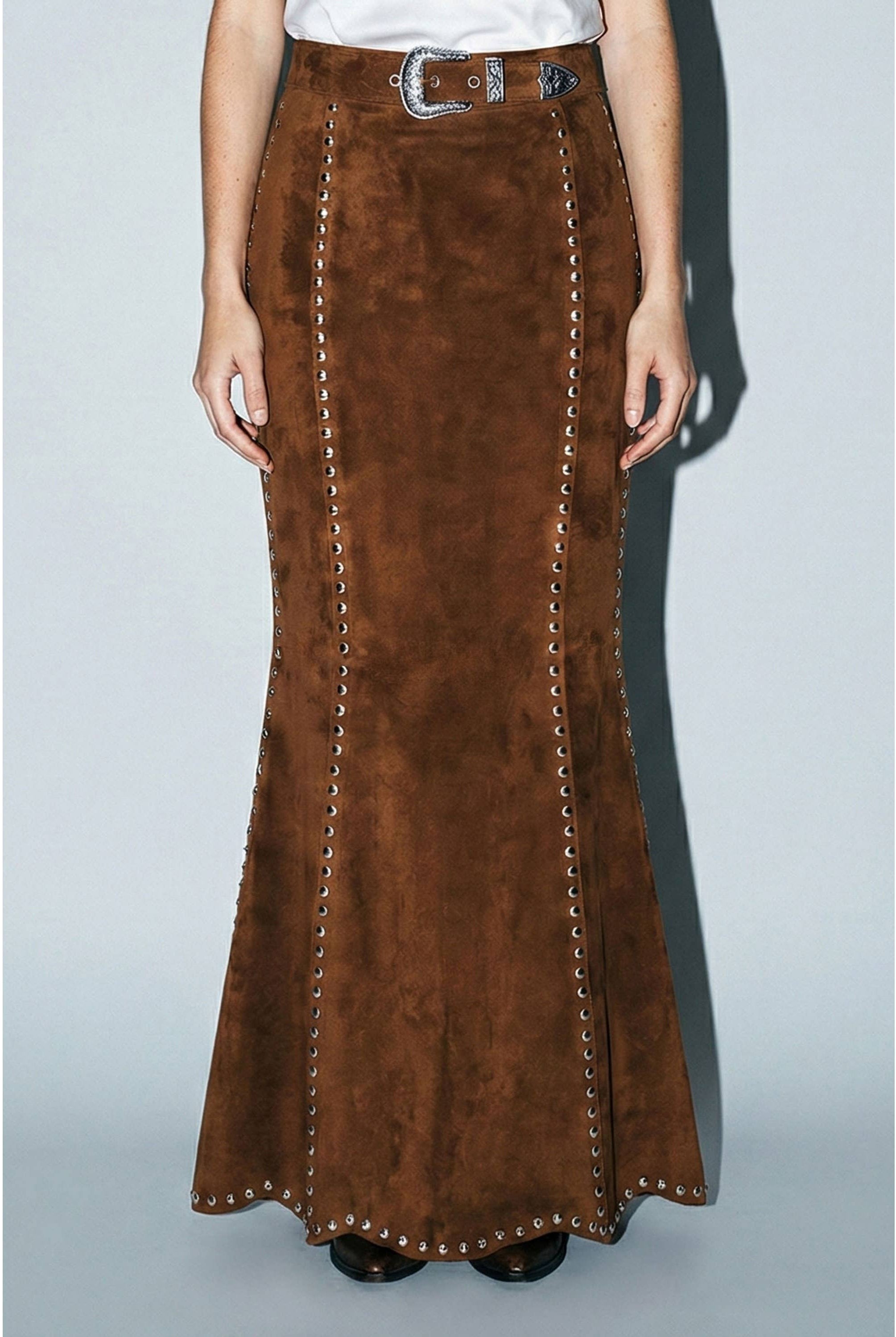 Skylar Rose suede studded maxi skirt, featuring a flowing silhouette with metal stud embellishments, styled on a model.