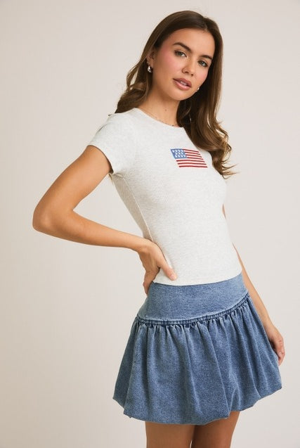 RARA Boutique embroidered American flag ribbed baby tee with patriotic flag design and comfortable fit for infants.