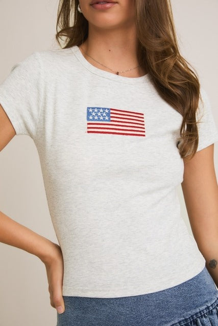 Rara Boutique embroidered American flag ribbed baby tee, soft cotton T-shirt with patriotic flag design for infants.
