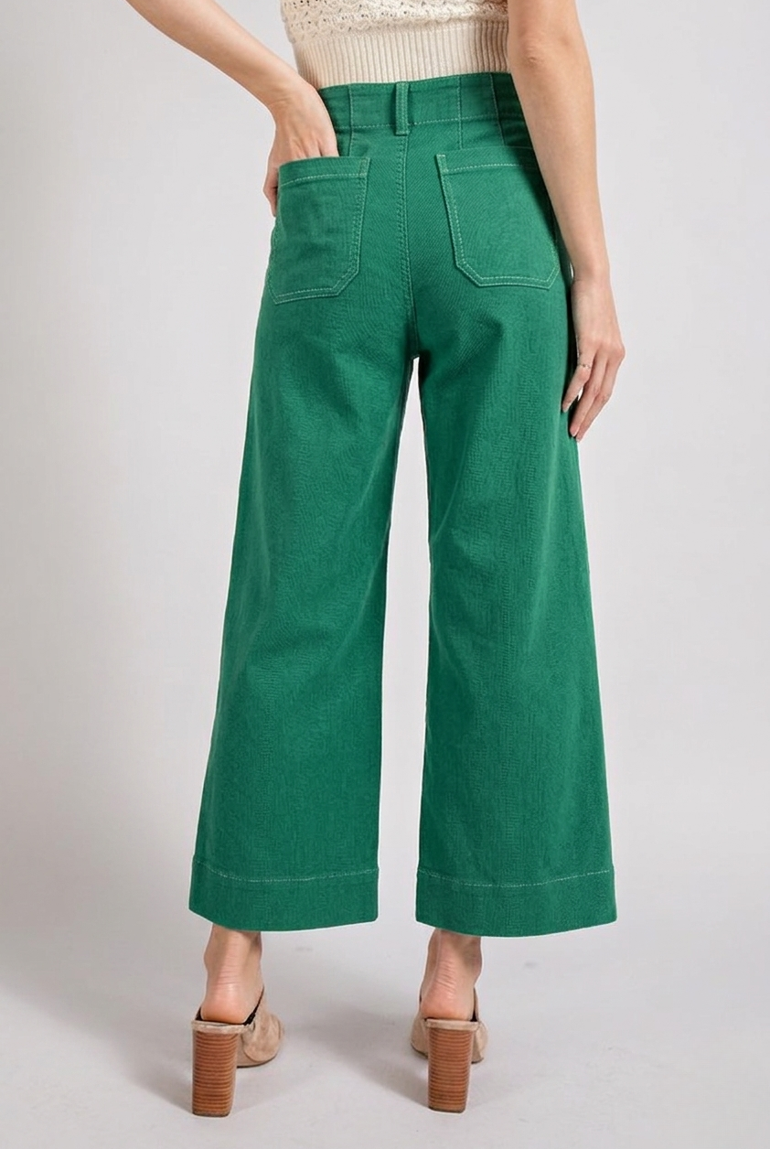 Light blue soft wash wide leg jeans from RARA Boutique with a relaxed fit and high waist, displayed on a hanger.