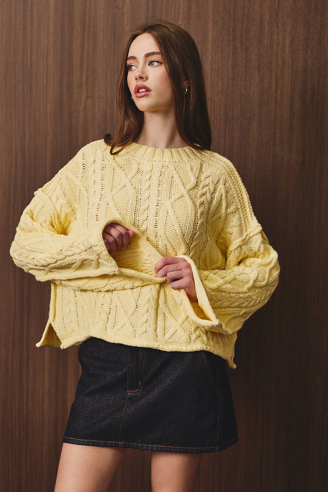 LE LIS oversized cropped cable knit sweater showing thick knit texture and relaxed fit in a cozy, stylish design.