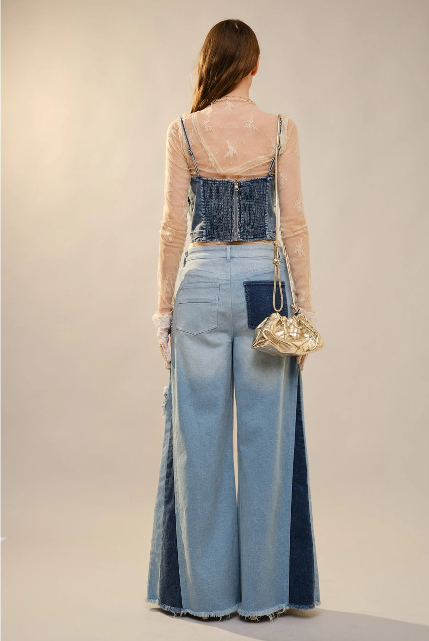 Blue butterfly embellished denim corset blouse from RARA Boutique, featuring detailed butterfly accents and a fitted denim design.