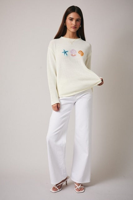 Lightweight knit sweater with coastal seashell pattern from RARA Boutique, featuring a comfortable fit and soft fabric.