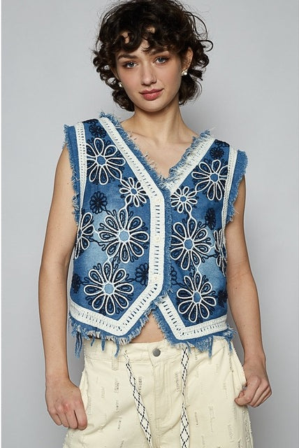 Crochet floral V-neck denim vest by RARA Boutique featuring intricate floral embroidery and sleeveless design.