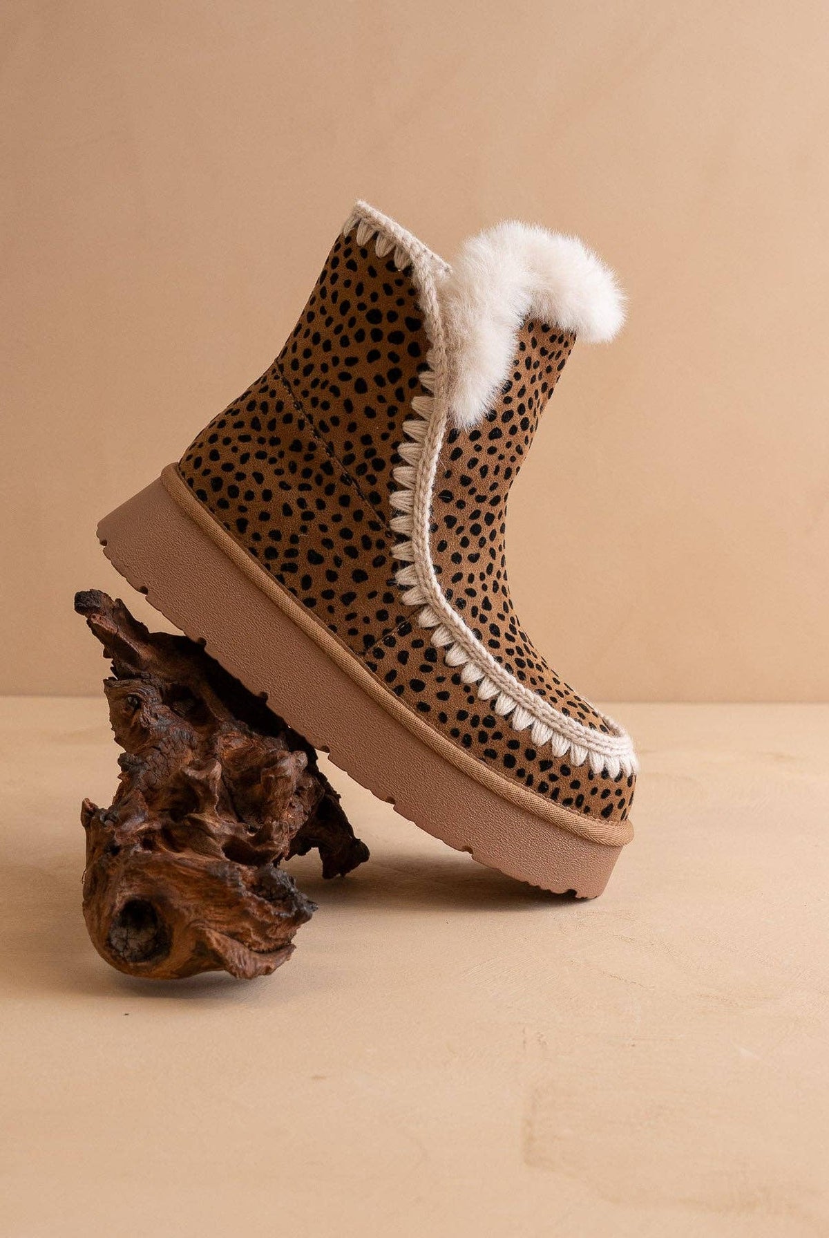 Dark cheetah shearling trim platform winter boot from Oasis Society featuring a sturdy sole and cozy shearling accents.