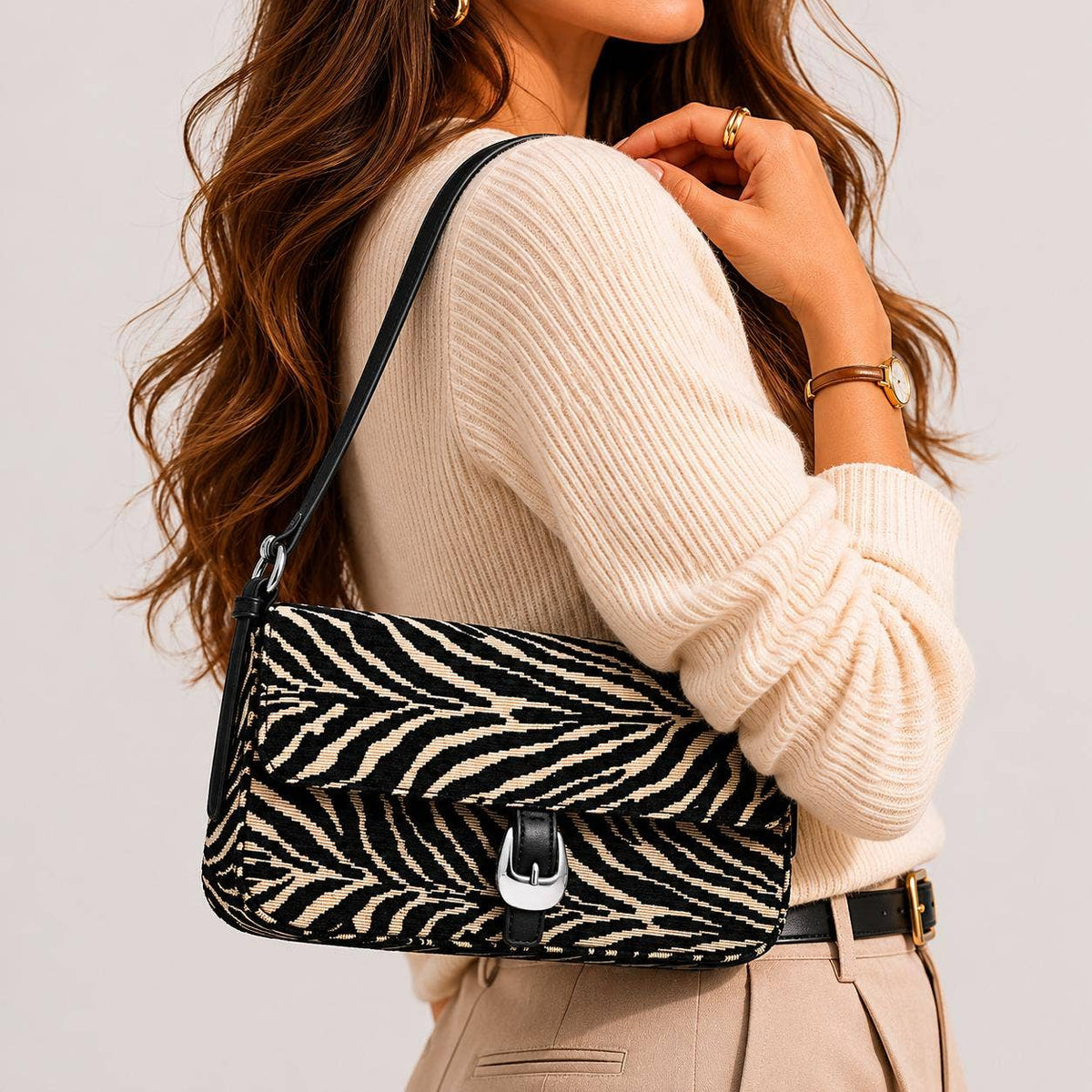 Urban Expressions Tuesday Gloria zebra shoulder bag with adjustable strap and stylish black and white zebra print fabric.