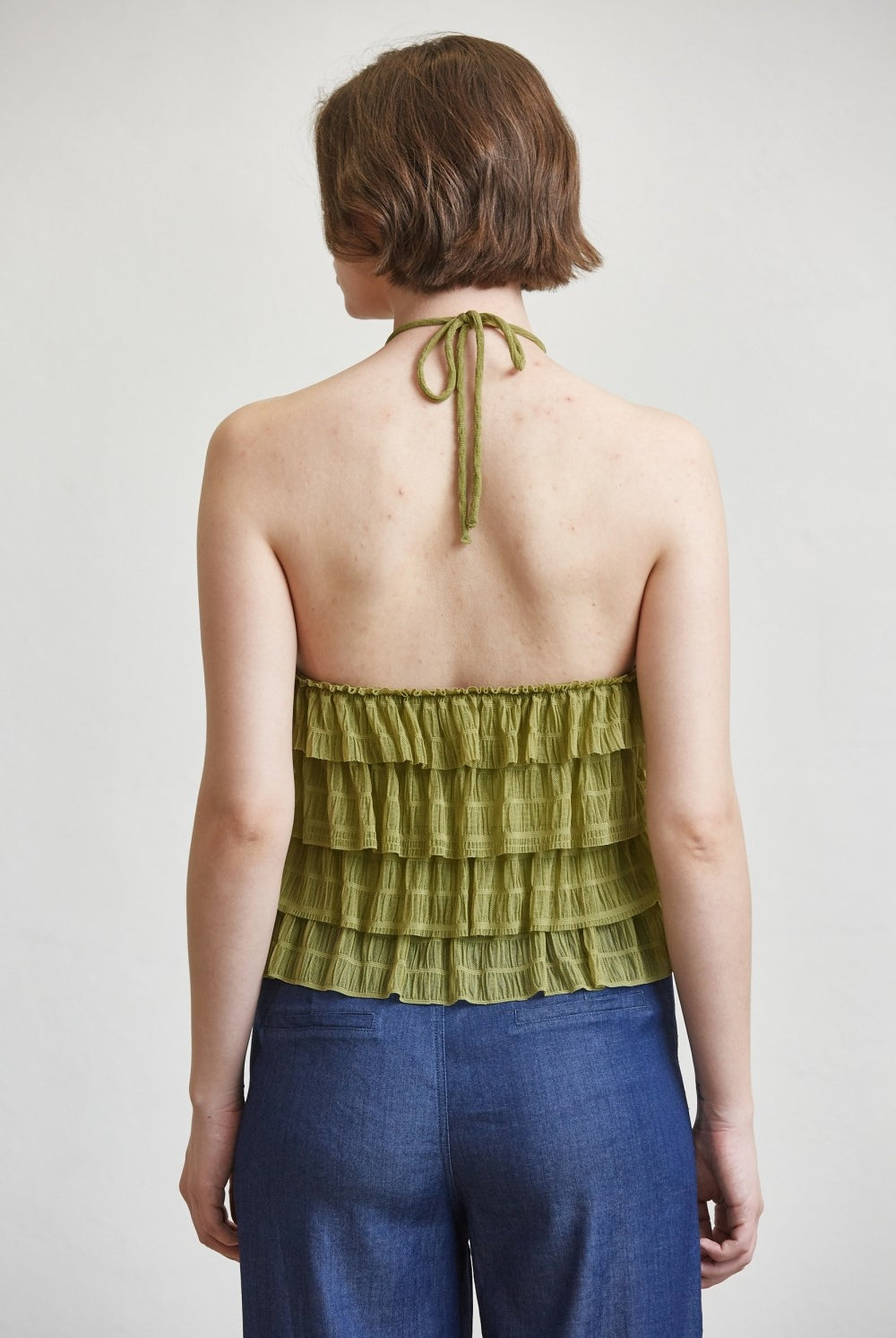 RARA Boutique tiered ruffle halter neck tank top with layered fabric and stylish design, shown on a mannequin.