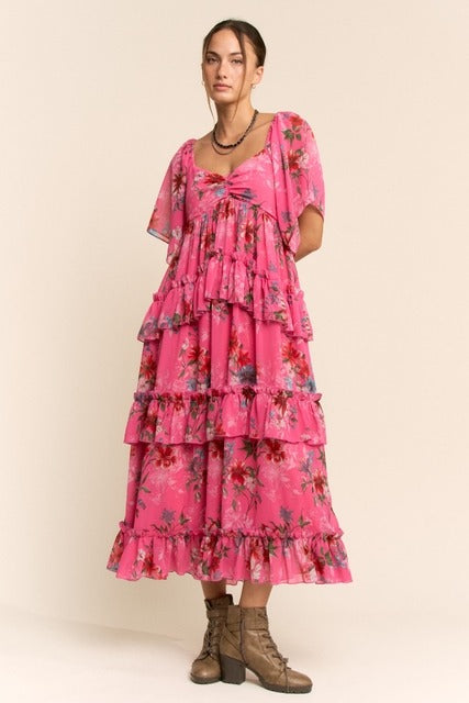 Floral tiered ruffle maxi dress with flutter sleeves by RARA Boutique, showcasing a flowy, bohemian style with vibrant floral print.