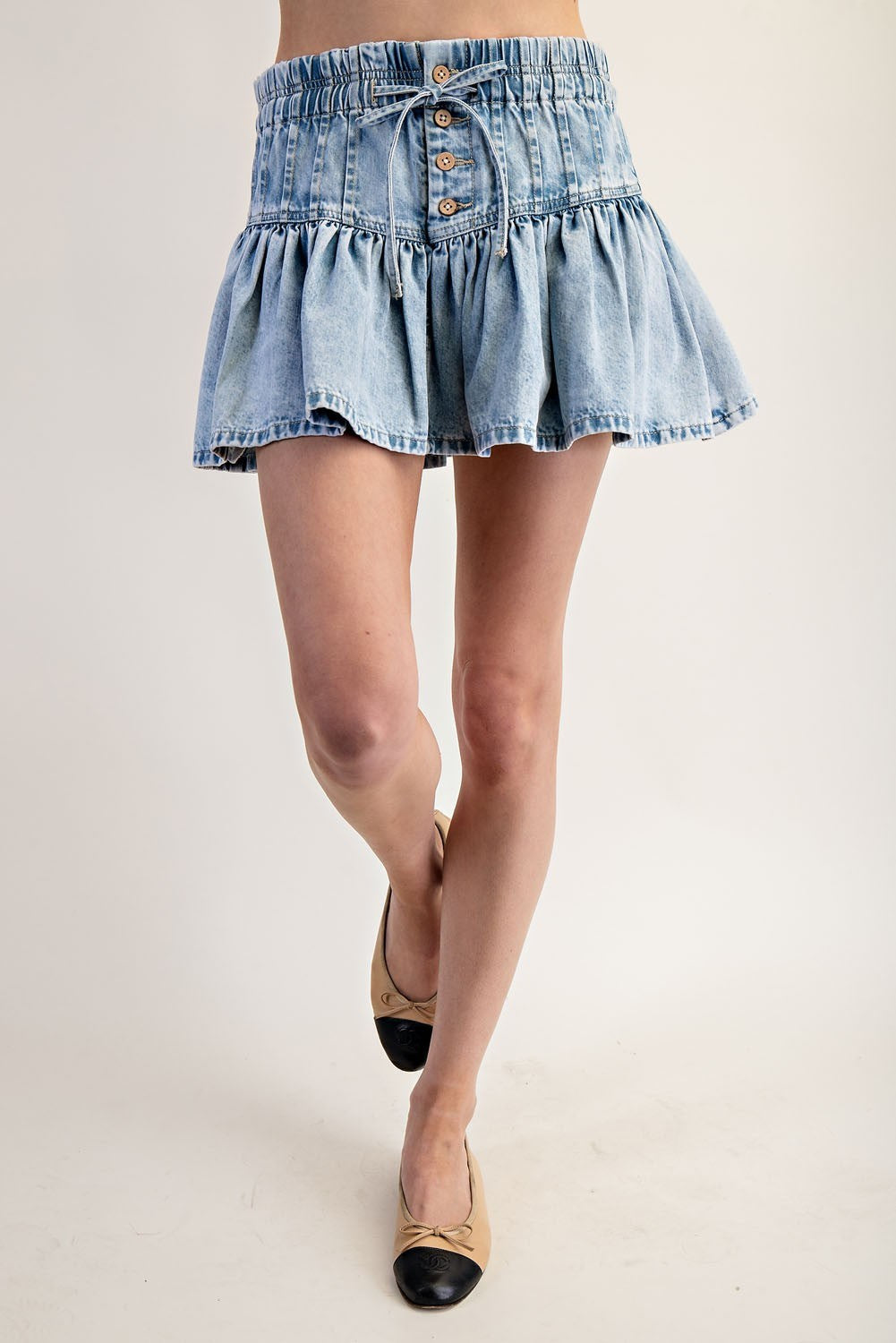 Ruffle flared denim mini skirt with elastic waist from RARA Boutique, featuring a trendy design and casual style.