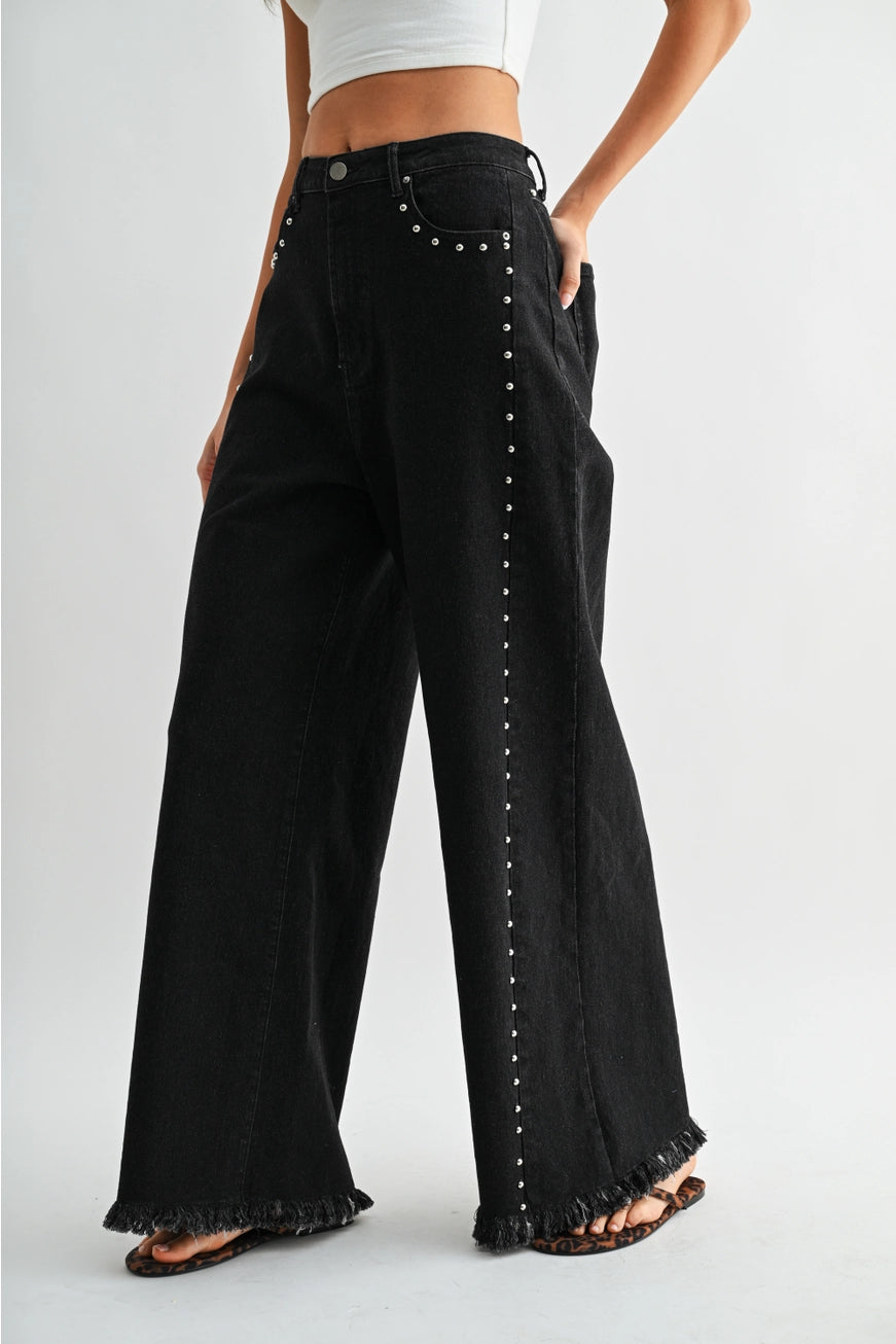 RARA Boutique studded ultra wide leg washed jeans with distressed details and a relaxed fit, showcasing the trendy denim style.