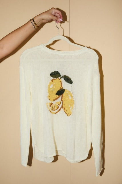 RARA Boutique lemon graphic lightweight knit sweater featuring a vibrant lemon print on soft fabric.