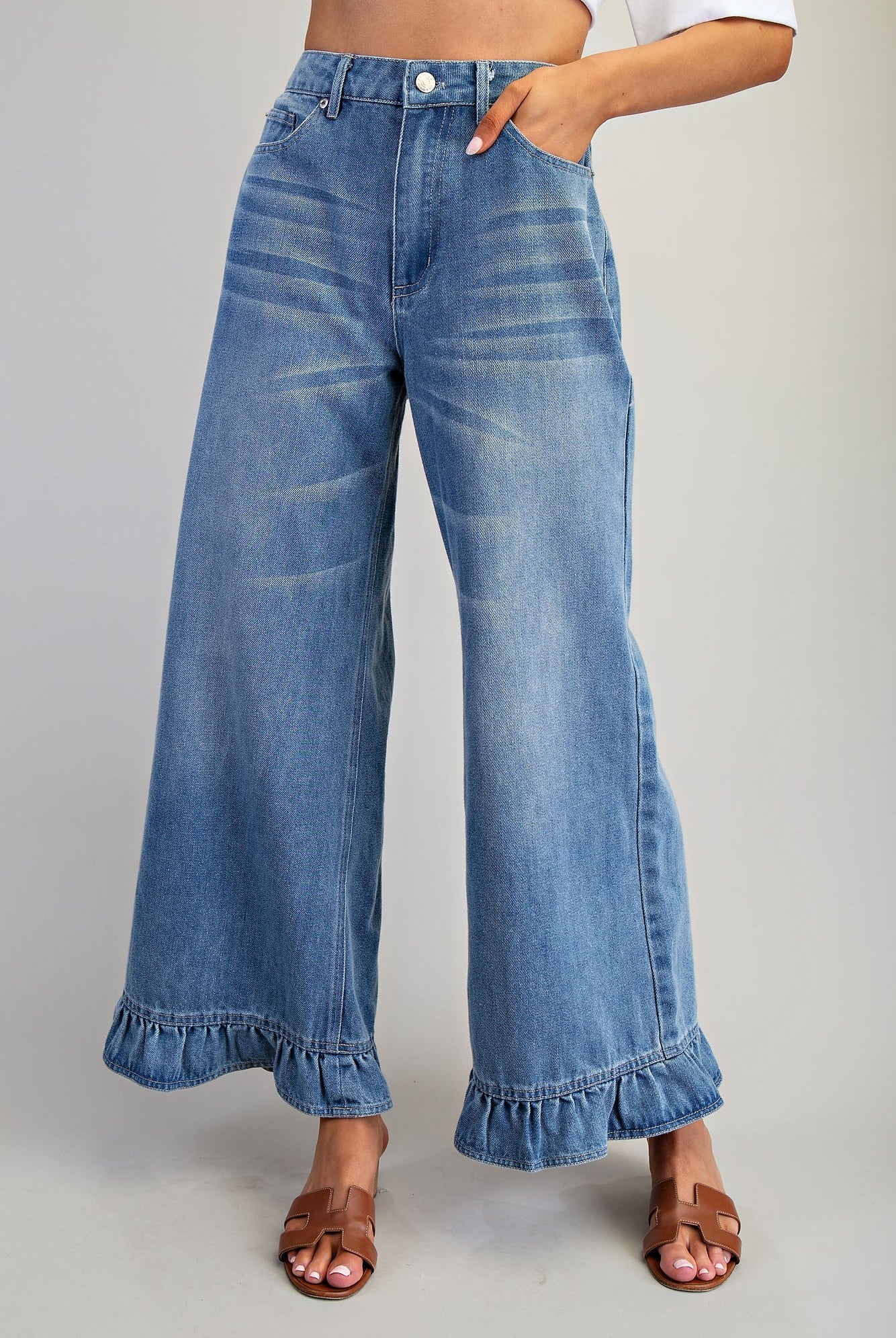 Ruffle hem wide leg mineral washed jeans by RARA Boutique, showing the relaxed fit and stylish ruffle detail at the hem.
