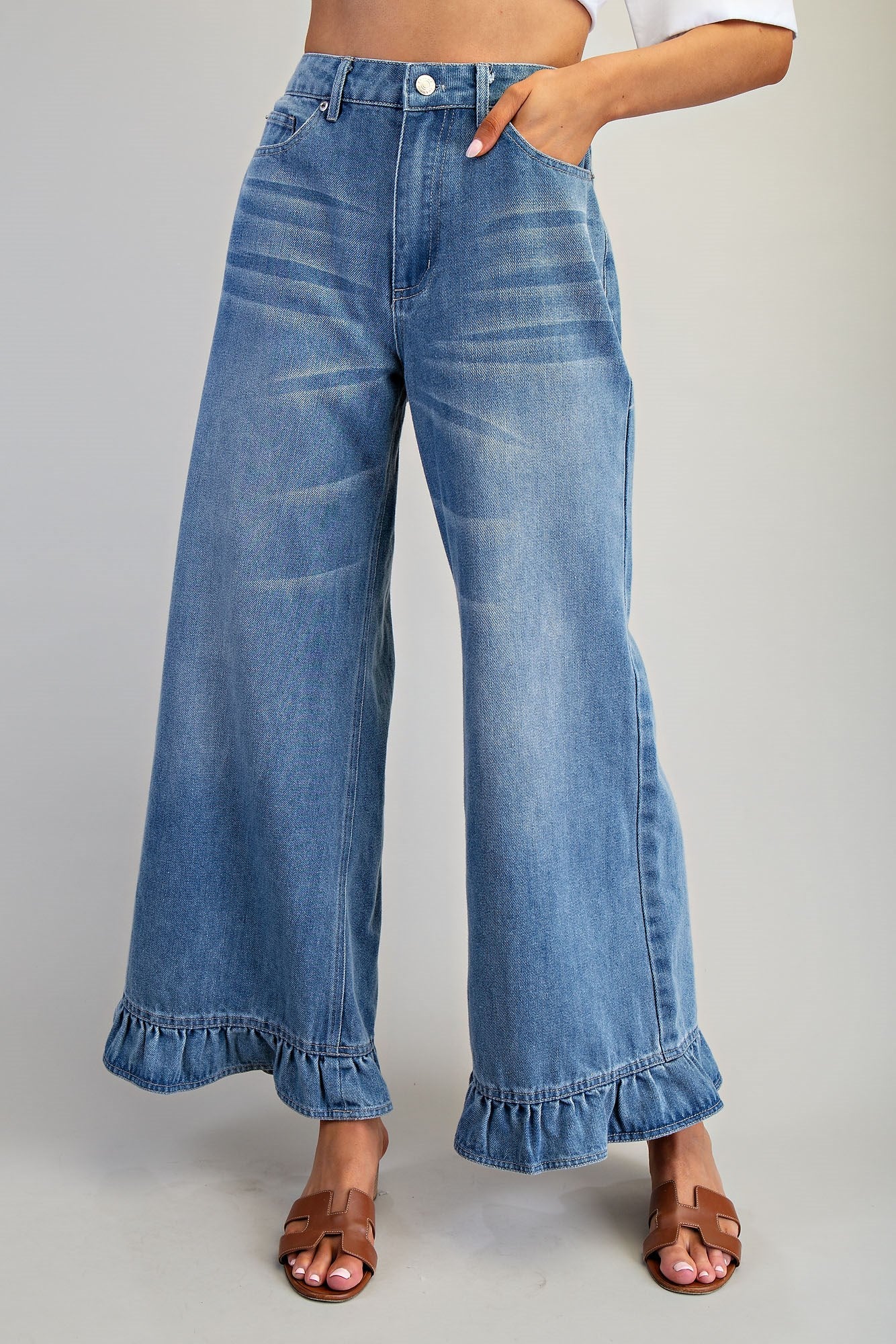 Ruffle hem wide-leg mineral washed jeans by RARA Boutique, featuring relaxed fit and stylish ruffle details on the hem.