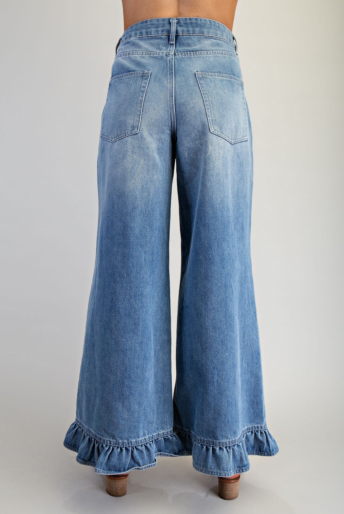 Ruffle hem wide-leg mineral washed jeans by RARA Boutique, featuring a relaxed fit and stylish ruffle details at the hem.