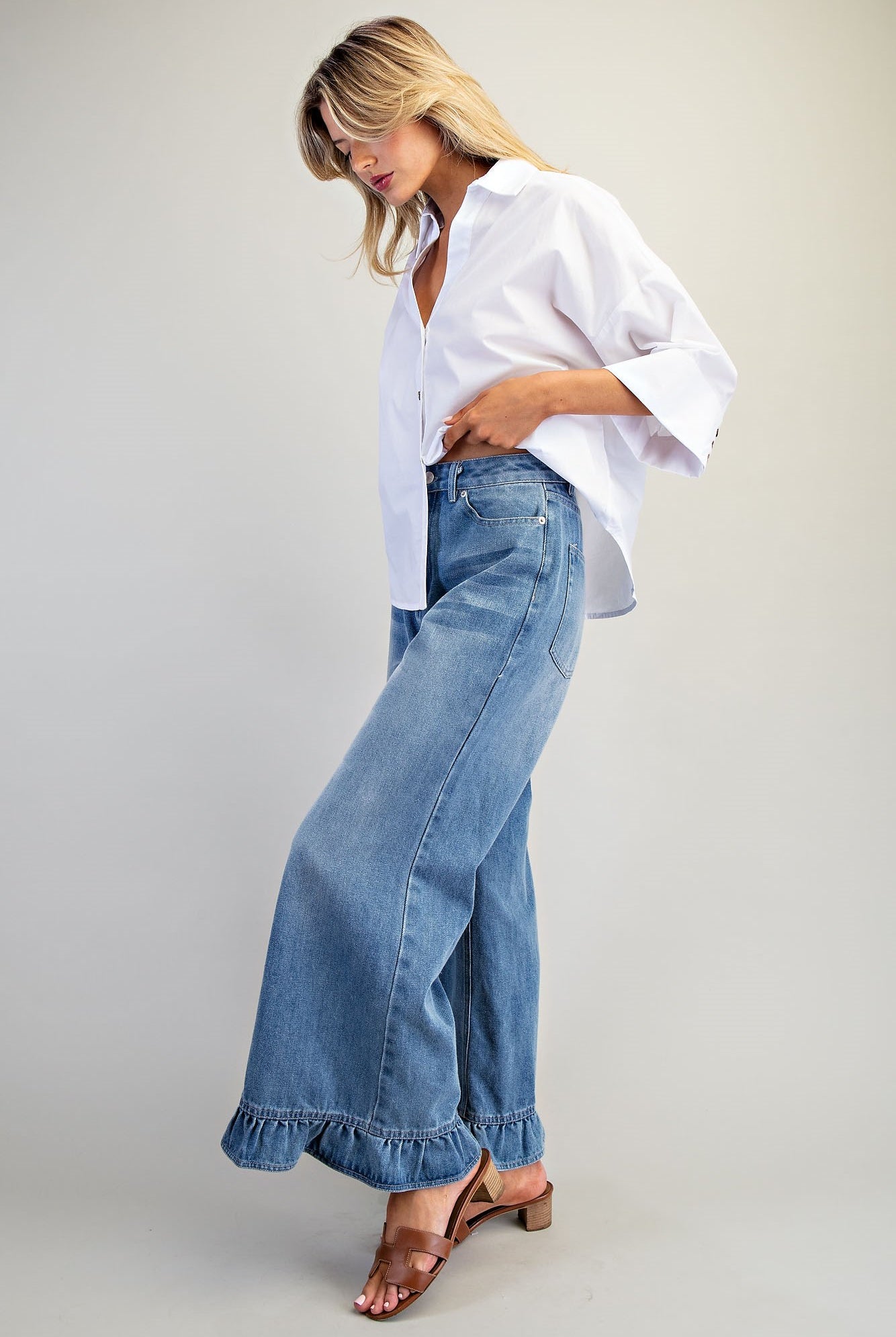 Ruffle hem wide-leg mineral washed jeans by RARA Boutique, featuring a relaxed fit and stylish ruffle detail at the hem.
