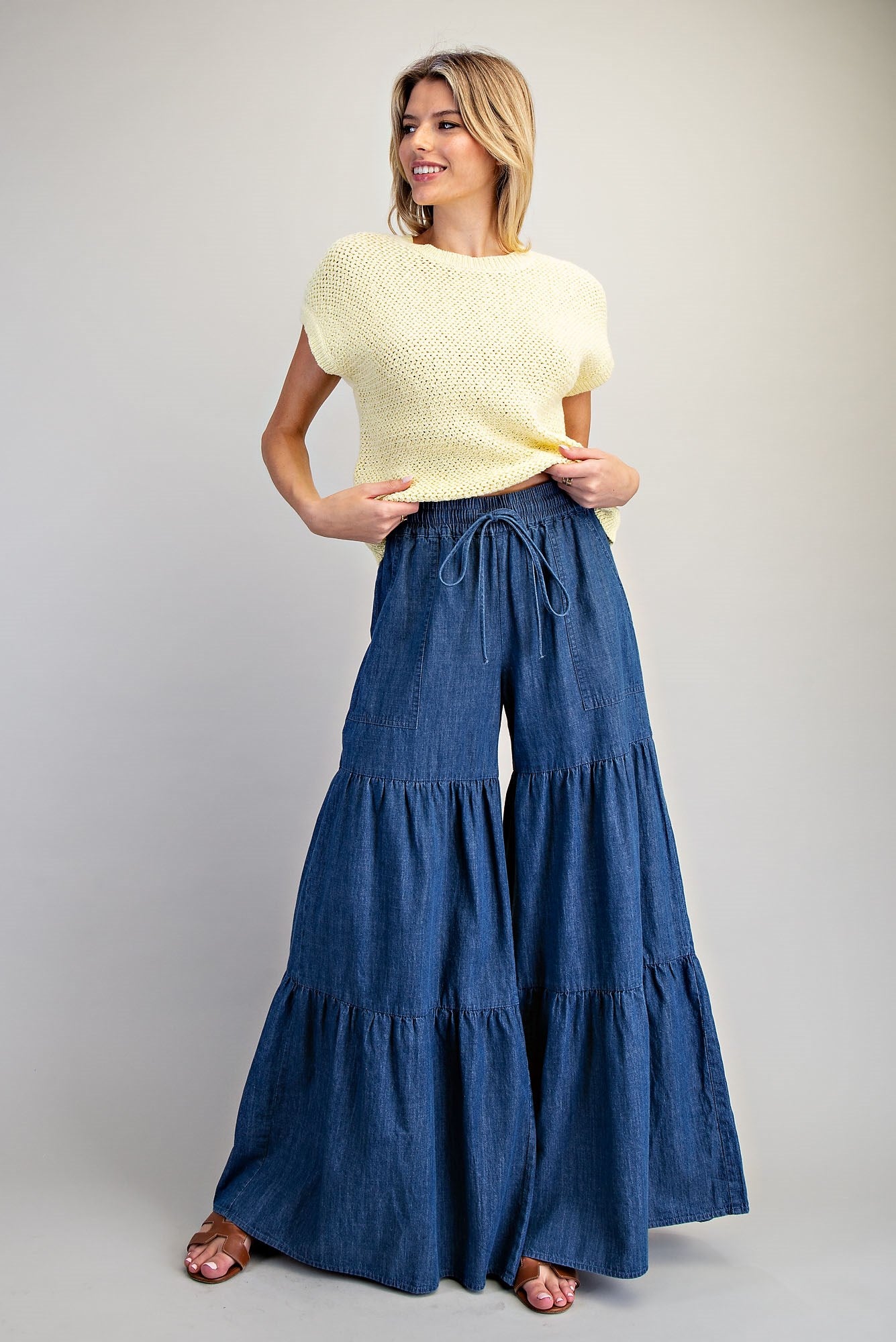 RARA Boutique mineral washed denim palazzo pants with tiered wide-leg design, ultra-wide fit, and stylish relaxed silhouette.