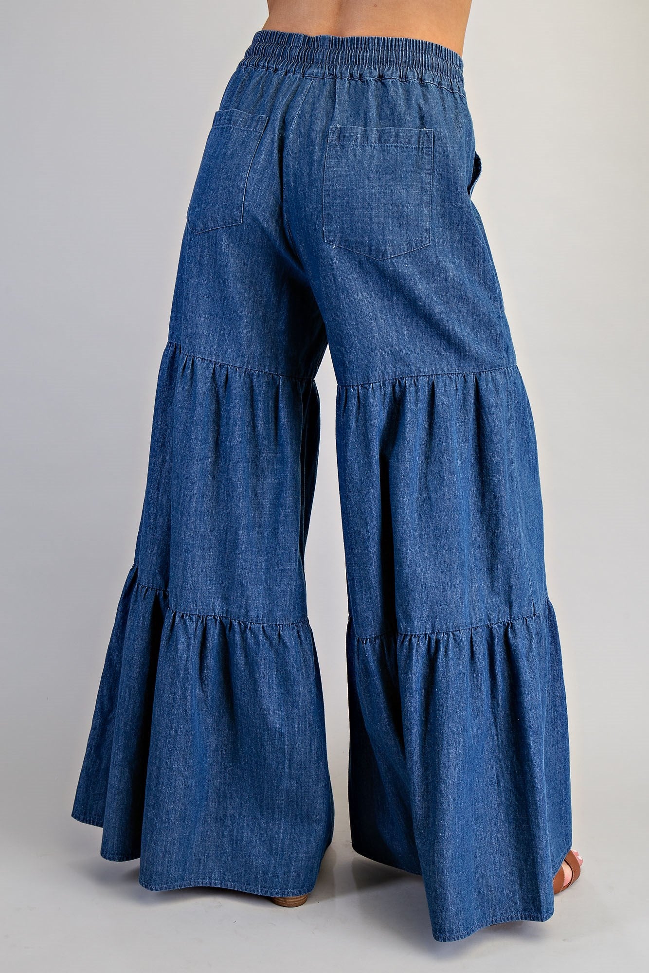 RARA Boutique mineral washed denim palazzo pants with tiered ultra-wide legs, relaxed fit, and stylish design.