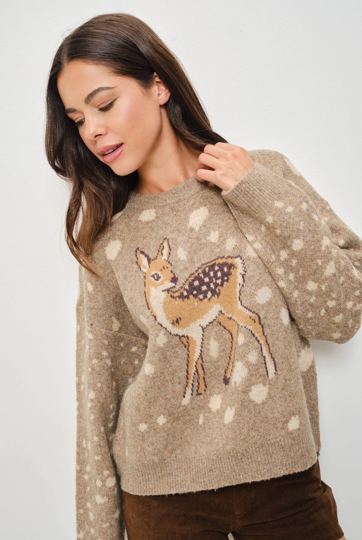 Pretty Garbage Tuesday deer print sweater featuring a cozy knit with a whimsical deer graphic on the front.