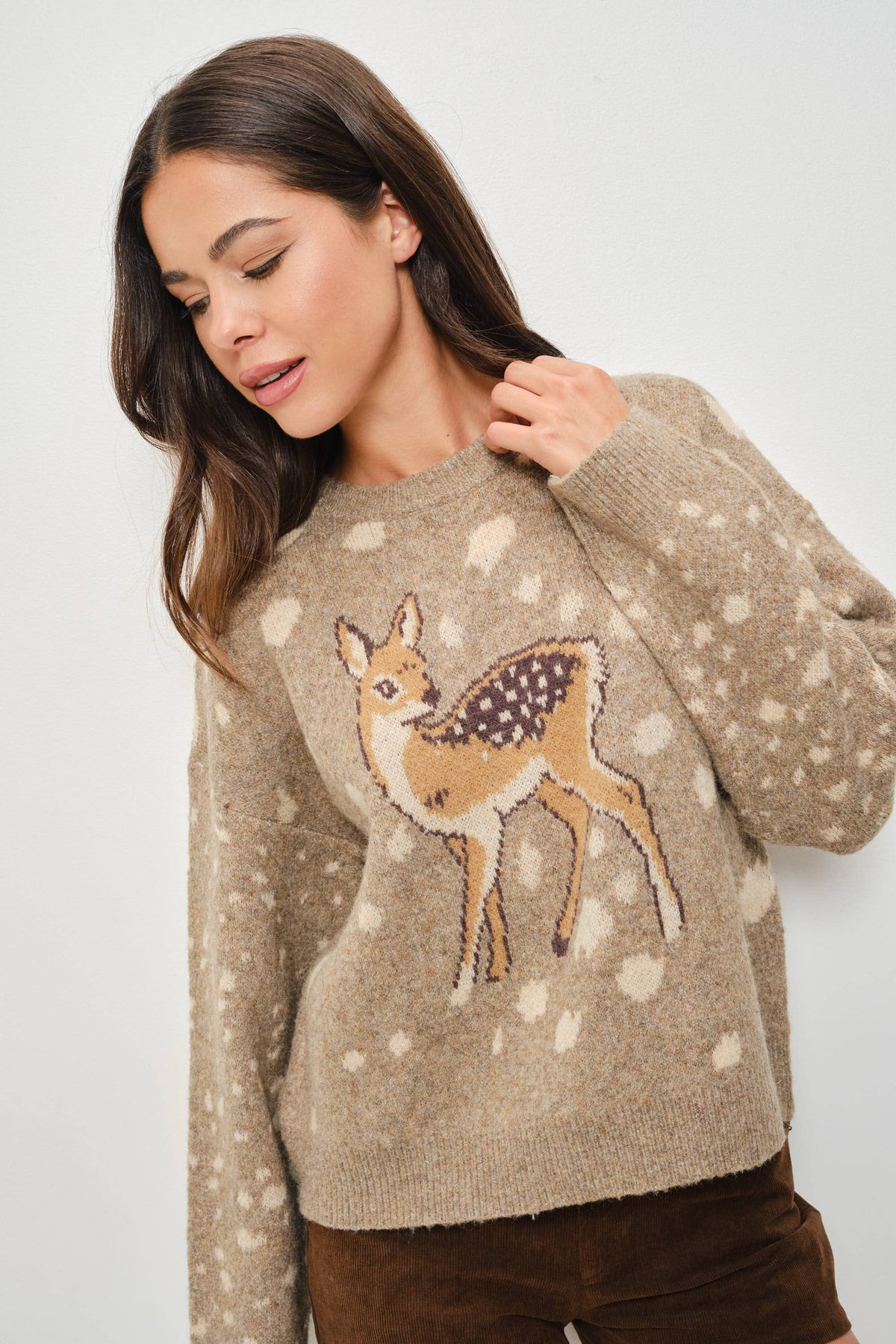 Pretty Garbage Tuesday deer print sweater featuring a cozy knit with a whimsical deer graphic on the front.