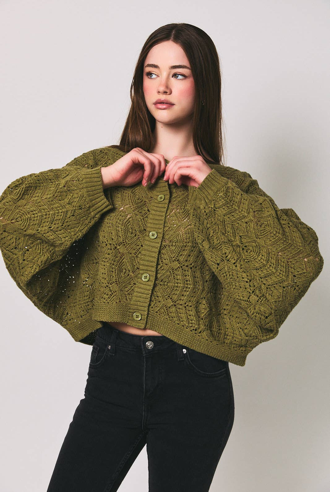 Le Lis long sleeve crochet cardigan in soft, intricate knit with a relaxed fit, displayed on a neutral background.