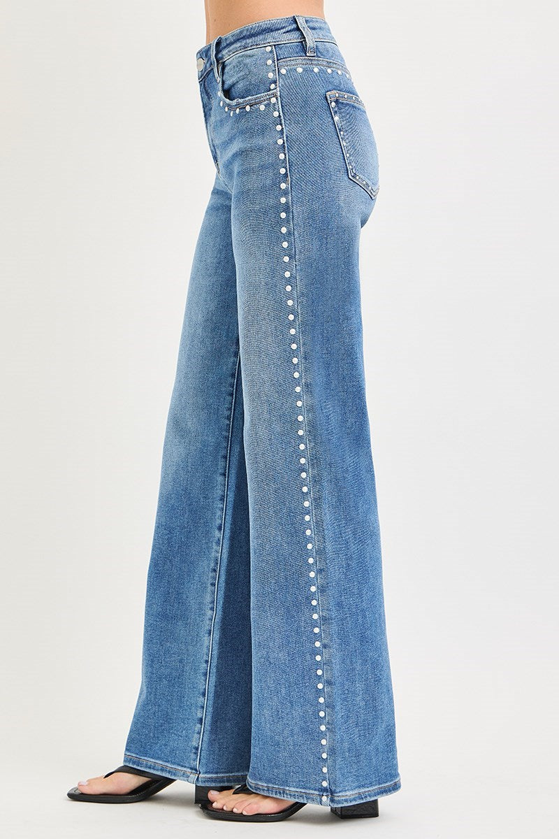 Medium wash Risen studded wide-leg high-rise jeans with belt loops and front pockets, stylish and fashionable denim pants.