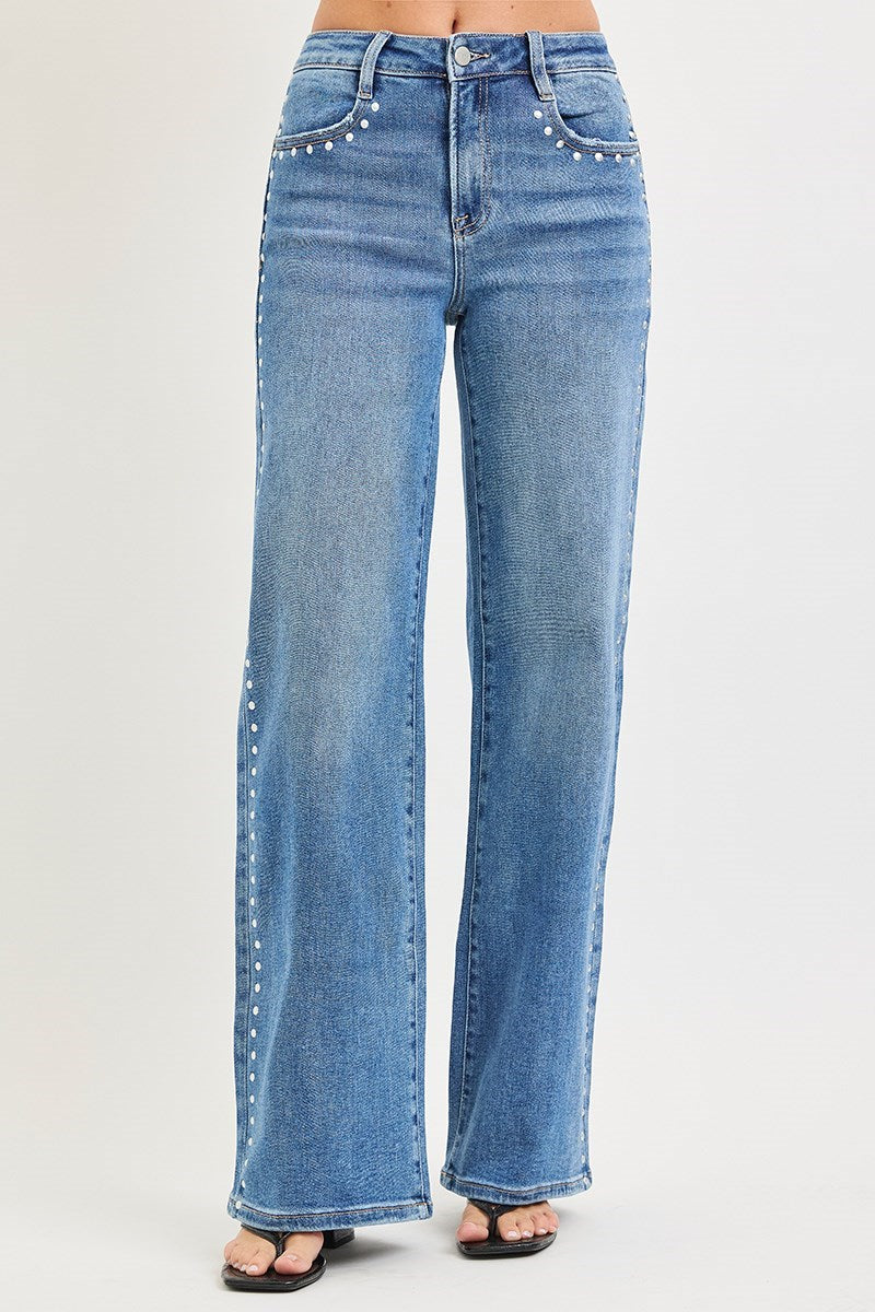 Medium shot of Risen studded wide-leg high-rise jeans from RARA Boutique, showcasing their stylish fit and distressed details.