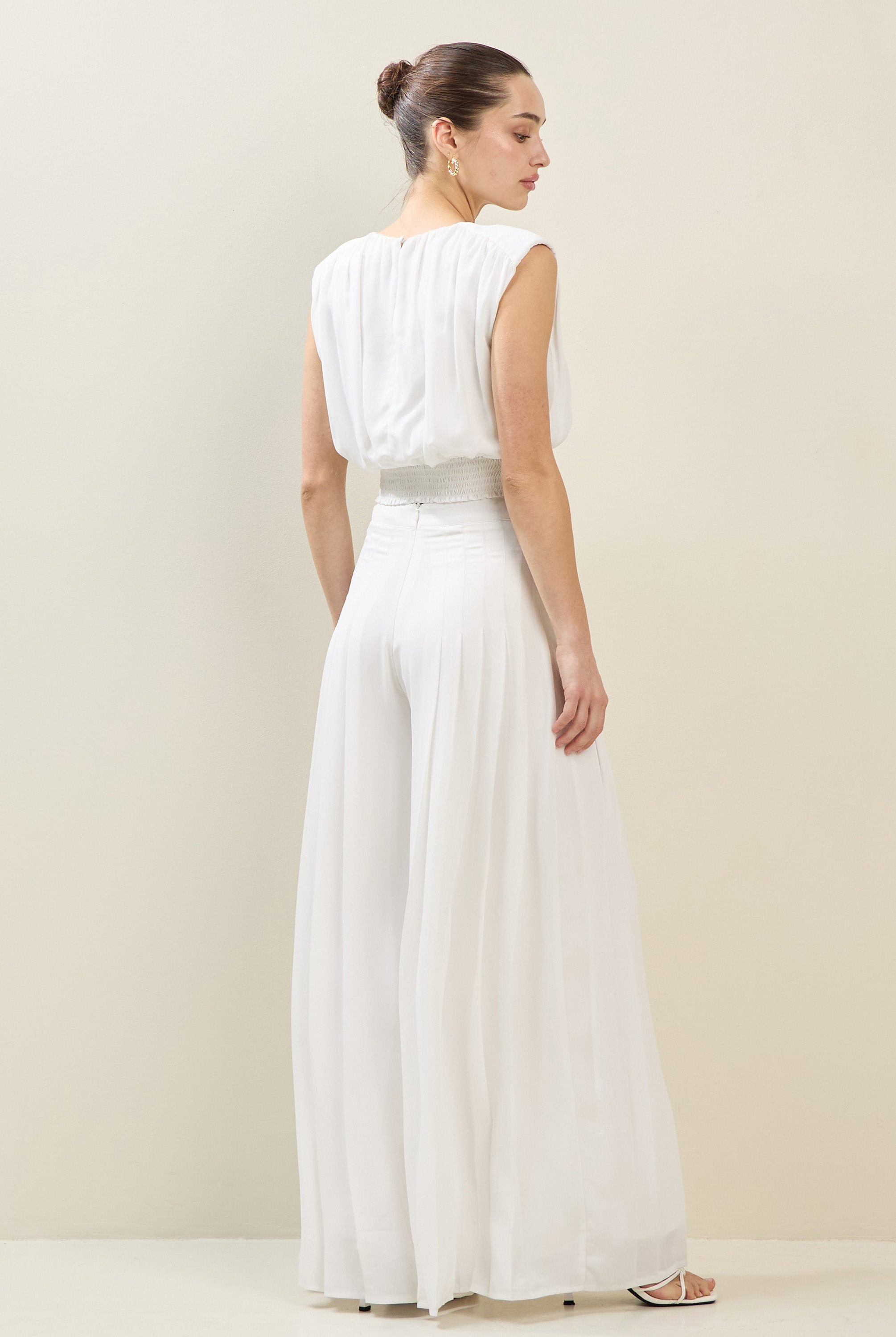 RARA Boutique satin chiffon pleated wide-leg palazzo trousers, stylish and flowing, shown on a model with a relaxed fit.