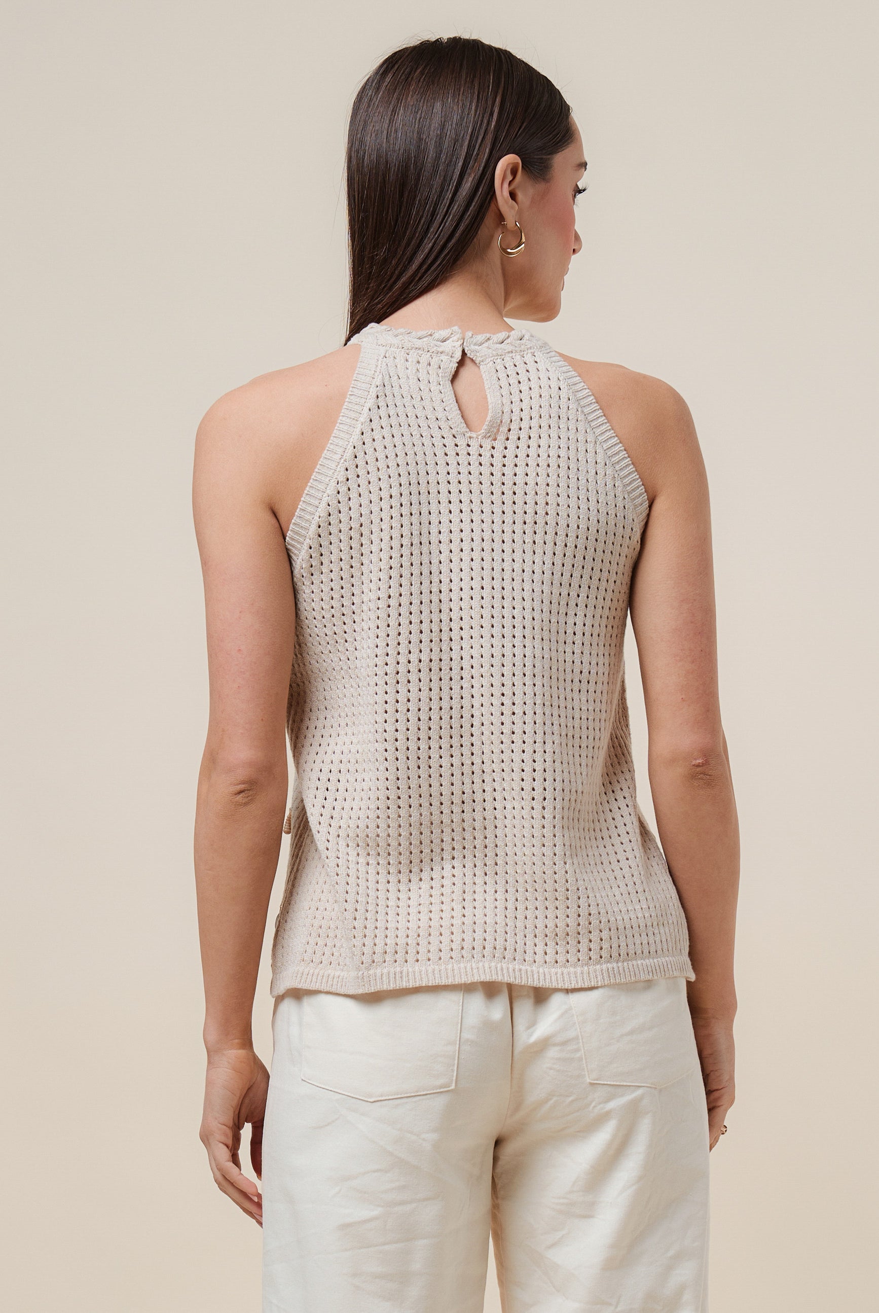 Seashell embellished open-knit halter tank top by RARA Boutique featuring a stylish, lightweight design with natural seashell accents.