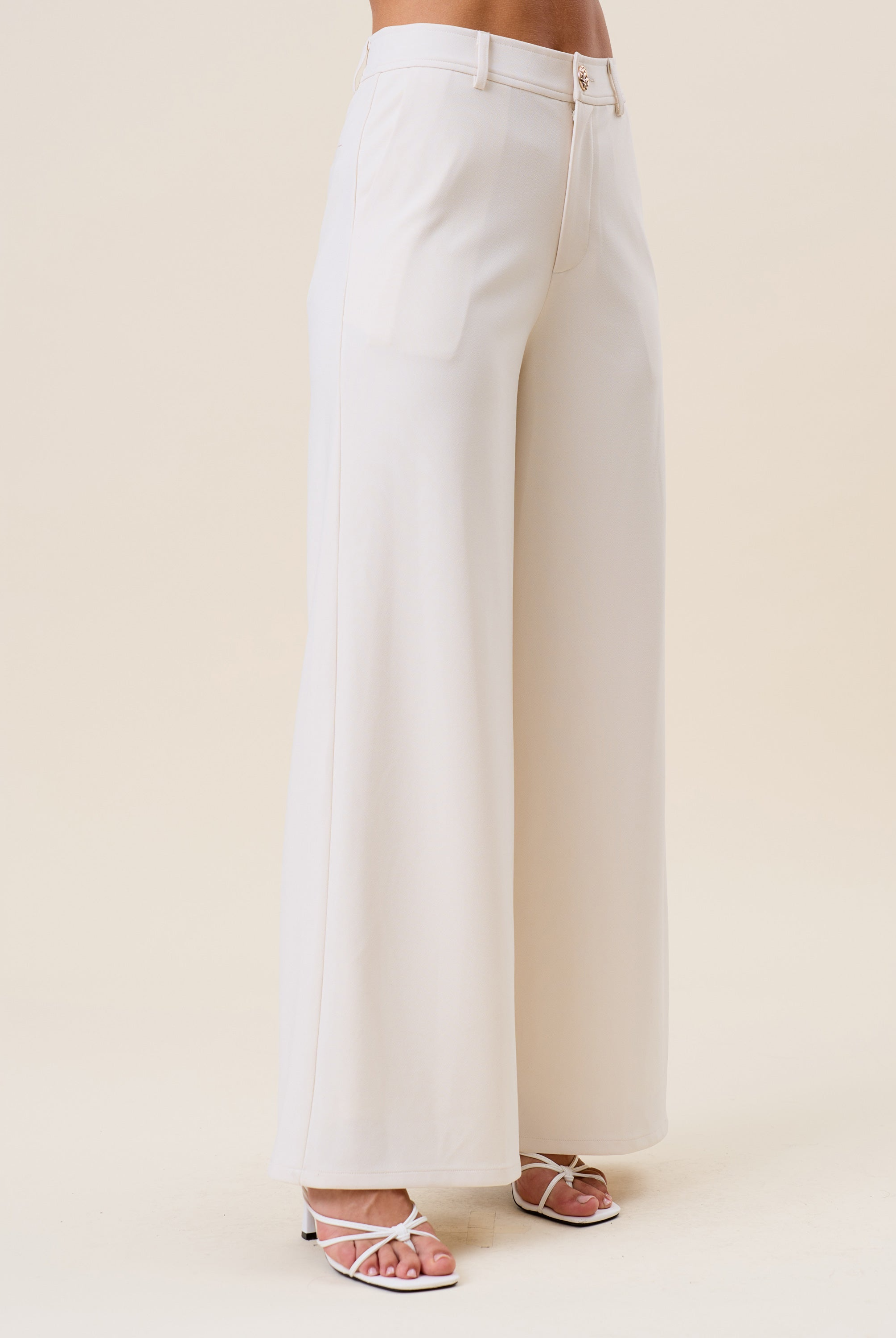 High waist tailored wide-leg trousers by RARA Boutique, showing the fit and fabric details of these stylish women's trousers.