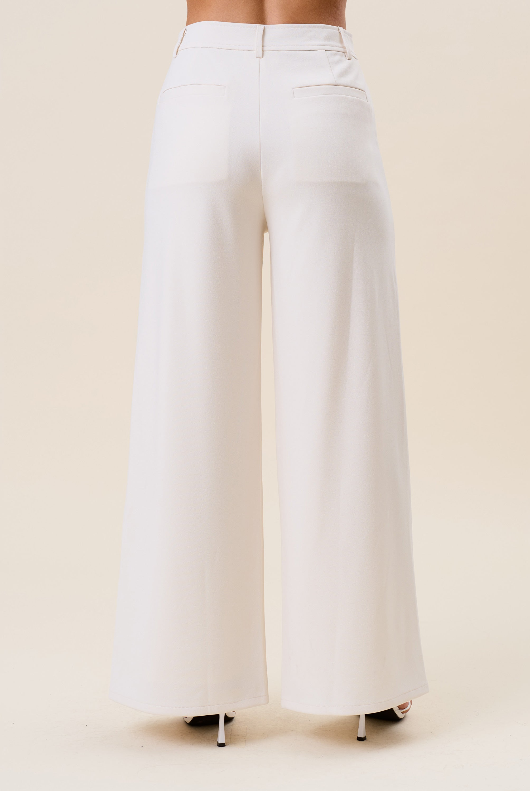 High waist tailored wide-leg trousers by RARA Boutique, shown in a neutral color with a sleek, structured fit and classic design.