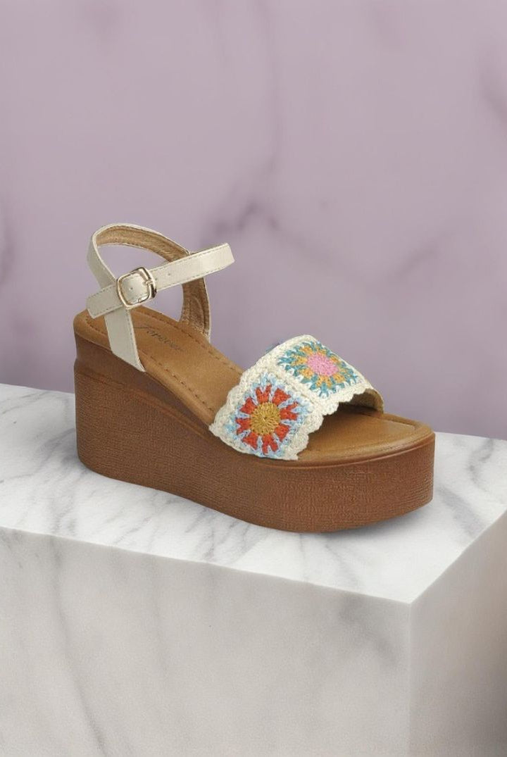 Beige granny square crochet wedge sandals by RARA Boutique featuring open-toe design and ankle straps.