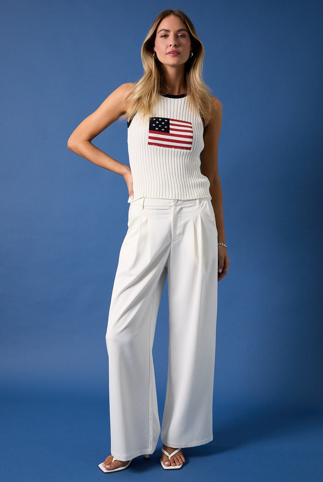 White and navy American flag sleeveless knit tank top by RARA Boutique, featuring patriotic star and stripe design.
