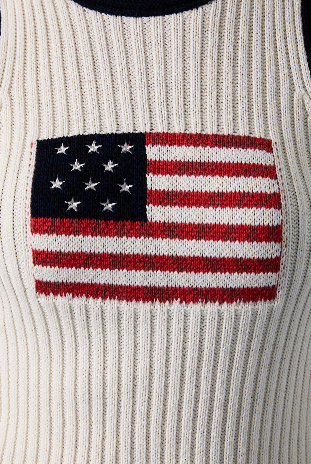 White and navy American flag sleeveless knit tank top by RARA Boutique, featuring patriotic star and stripe design.